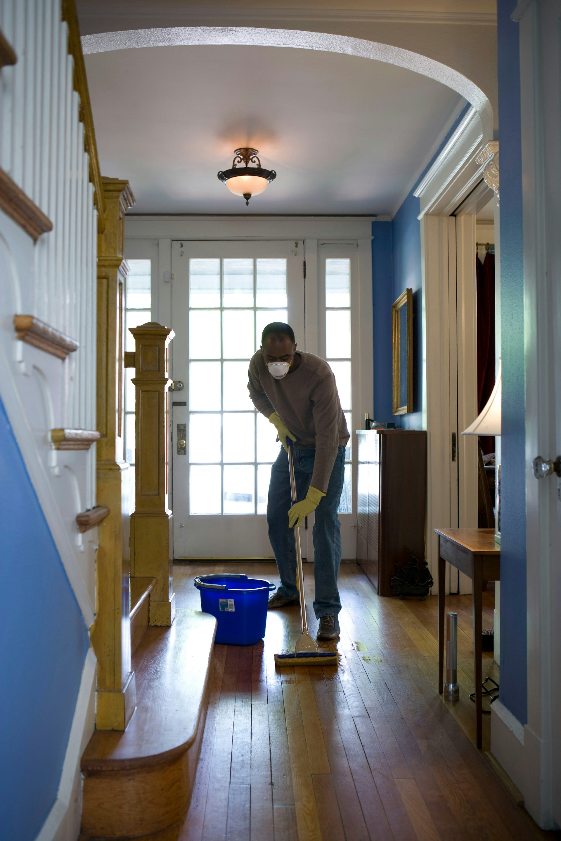 A professional cleaner attending carefully to a surface